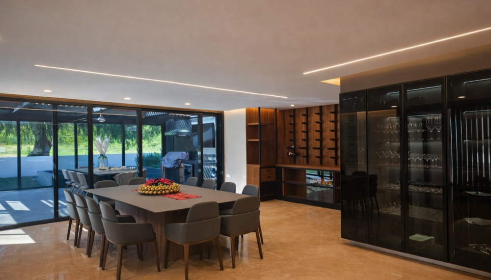 Diseño de interiores para comedor y estancia con iluminación ambiental para proyecto residencial H18